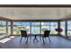 Serene sunroom with tiled flooring and panoramic views of the waterfront at 1504 Valley Forge Blvd, Sun City Center, FL 33573