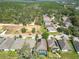 Aerial view of single-story homes in a residential community, showcasing their location and landscape at 19724 Fort King Run, Brooksville, FL 34601