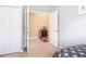 Bedroom with an open door to an office and a double door closet at 19724 Fort King Run, Brooksville, FL 34601