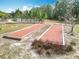 Bocce Ball court with well maintained landscape within a residential community at 19724 Fort King Run, Brooksville, FL 34601