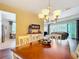 Open dining room with hardwood floors and a view of the living room at 19724 Fort King Run, Brooksville, FL 34601