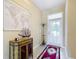 Inviting foyer with tiled flooring, decor, and a convenient coat rack at 19724 Fort King Run, Brooksville, FL 34601