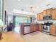 Cozy kitchen with stainless steel appliances, granite countertops, and easy access to living spaces at 19724 Fort King Run, Brooksville, FL 34601