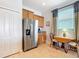 The bright kitchen with stainless steel appliances, granite countertops, and tile flooring at 19724 Fort King Run, Brooksville, FL 34601