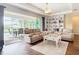 Open concept living room leading to a screened in pool at 19724 Fort King Run, Brooksville, FL 34601