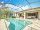 Inviting pool and patio space with a screened-in enclosure at 19724 Fort King Run, Brooksville, FL 34601