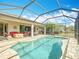 Stunning pool area, perfect for entertaining, featuring a screened-in enclosure at 19724 Fort King Run, Brooksville, FL 34601