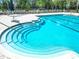 Community pool featuring steps leading into a clear blue, refreshing pool at 19724 Fort King Run, Brooksville, FL 34601