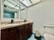 Bathroom boasts a double vanity with granite countertop, toilet, and tiled shower/tub combo at 2630 Pearce Dr # 107, Clearwater, FL 33764
