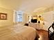 Bedroom showcasing wood flooring, natural light, neutral decor and a window view at 2630 Pearce Dr # 107, Clearwater, FL 33764