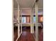 Spacious bedroom shows off wood floors and a balcony view through mirrored closet doors at 2630 Pearce Dr # 107, Clearwater, FL 33764