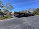 Covered carport with multiple parking spaces, offering protection from the elements at 2630 Pearce Dr # 107, Clearwater, FL 33764
