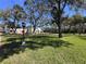 The grounds include a grassy yard, swimming pool and clubhouse at 2630 Pearce Dr # 107, Clearwater, FL 33764