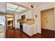 Clean, efficient kitchen featuring stone countertops, modern stainless steel appliances, and wood floors at 2630 Pearce Dr # 107, Clearwater, FL 33764