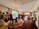 Spacious living room showing view into dining area, with wood and carpet flooring at 2630 Pearce Dr # 107, Clearwater, FL 33764