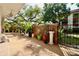 The outdoor patio features manicured greenery along the brick wall at 2630 Pearce Dr # 107, Clearwater, FL 33764