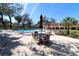 Inviting pool area with comfortable seating, ideal for relaxing and enjoying the community's amenities at 2630 Pearce Dr # 107, Clearwater, FL 33764