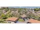 Aerial view of neighborhood with mature trees, landscaping and parking at 2934 Lichen Ln # C, Clearwater, FL 33760