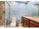 Neutral-toned bathroom with light blue walls and a glass-door shower at 2934 Lichen Ln # C, Clearwater, FL 33760