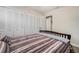 Bedroom features a large closet, ceiling fan, and neutral walls at 2934 Lichen Ln # C, Clearwater, FL 33760