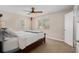 Bright bedroom featuring a ceiling fan and a view from the window at 2934 Lichen Ln # C, Clearwater, FL 33760