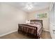 Cozy bedroom featuring neutral walls and carpet, ceiling fan, window and closet at 2934 Lichen Ln # C, Clearwater, FL 33760