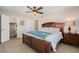 Spacious bedroom with carpet, a ceiling fan and a wooden bed frame at 2934 Lichen Ln # C, Clearwater, FL 33760