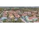 Aerial view of the colorful townhomes with plenty of parking and mature landscaping in a waterfront community at 3600 42Nd S St # 52B, St Petersburg, FL 33711