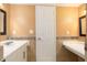 Bathroom featuring double sink vanity and mosaic tile backsplash at 3600 42Nd S St # 52B, St Petersburg, FL 33711