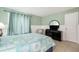 Bedroom featuring dresser, TV, and closet at 3600 42Nd S St # 52B, St Petersburg, FL 33711