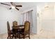 Cozy dining area with a round table and stylish chairs at 3600 42Nd S St # 52B, St Petersburg, FL 33711