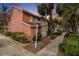Exterior view of the townhome with mature landscaping and well-manicured lawn in a waterfront community at 3600 42Nd S St # 52B, St Petersburg, FL 33711