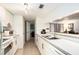 Clean kitchen with white cabinetry and tile floors at 3600 42Nd S St # 52B, St Petersburg, FL 33711