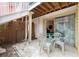 Secluded patio with seating, bamboo screen, and slider to interior at 3600 42Nd S St # 52B, St Petersburg, FL 33711