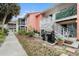 Private outdoor patio with a BBQ grill, stairs leading to the upper level, and mature landscaping at 3600 42Nd S St # 52B, St Petersburg, FL 33711