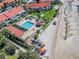 Aerial view of a community with beach access, a pool, kayaks, and picturesque views of the ocean at 3600 42Nd S St # 52B, St Petersburg, FL 33711