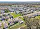 Scenic aerial view of a well-maintained residential community with lush green spaces and tree-lined streets at 36419 Flats St, Zephyrhills, FL 33541