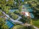 Overhead view of tennis facilities with tennis courts, parking area, and landscaping at Innisbrook Golf Resort at 36750 Us Highway 19 N # 6-214, Palm Harbor, FL 34684