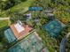 Aerial view of resort tennis facilities and the manicured golf green at Innisbrook Golf Resort Palm Harbor at 36750 Us Highway 19 N # 6-214, Palm Harbor, FL 34684