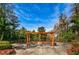 Community space with swings and benches in a park-like setting at 36750 Us Highway 19 N # 6-214, Palm Harbor, FL 34684