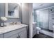 Elegant bathroom featuring a marble vanity and glass-enclosed shower with decorative tile at 36750 Us Highway 19 N # 6-214, Palm Harbor, FL 34684