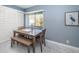 Bright dining area featuring a view, stylish furnishings, and modern decor at 36750 Us Highway 19 N # 6-214, Palm Harbor, FL 34684