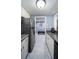 Efficient kitchen with stainless steel appliances, granite countertops, ample storage, and easy access to adjacent living spaces at 36750 Us Highway 19 N # 6-214, Palm Harbor, FL 34684