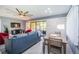 Comfortable living room, featuring a dining area and access to an outdoor patio at 36750 Us Highway 19 N # 6-214, Palm Harbor, FL 34684