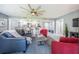 Open living area with tile floors and modern furnishings, adjacent to the kitchen at 36750 Us Highway 19 N # 6-214, Palm Harbor, FL 34684