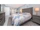 Comfortable main bedroom with a plush bed, natural light, and stylish decor at 36750 Us Highway 19 N # 6-214, Palm Harbor, FL 34684