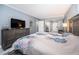 Comfortable main bedroom with a plush bed, natural light, and stylish decor at 36750 Us Highway 19 N # 6-214, Palm Harbor, FL 34684