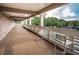 Outdoor balcony with view of the tennis courts and the manicured lawn at Innisbrook tennis center at 36750 Us Highway 19 N # 6-214, Palm Harbor, FL 34684