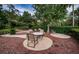 Community outdoor seating area with lush landscaping at 36750 Us Highway 19 N # 6-214, Palm Harbor, FL 34684
