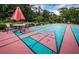 A view of the shuffleboard court and table with umbrella to protect from the sun at Innisbrook at 36750 Us Highway 19 N # 6-214, Palm Harbor, FL 34684